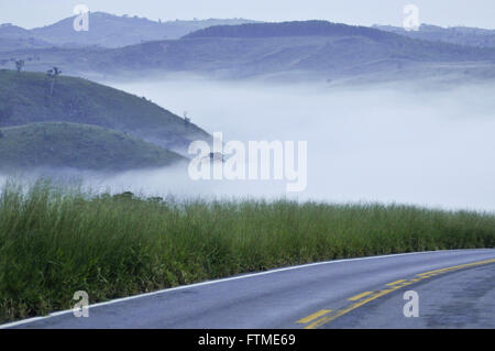Early morning with fog on the highway MG-341 Stock Photo