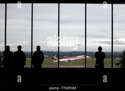 People watching the planes take off from the Afonso Pena International Airport Stock Photo