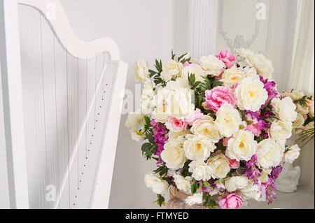 Summer bouquet of pink and white flowers in antique vintage interior Stock Photo
