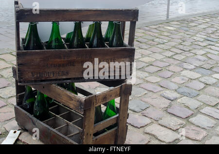 Empty bottles of wine in wooden cases Stock Photo