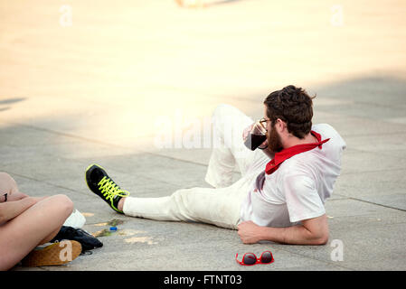 Spain Navarra Pamplona 10 July 2015 S Firmino fiesta a boy lying on the sidewalk during the festival, for s Firmino they consume Stock Photo