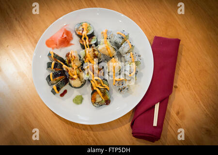 Fancy Japanese tempura sushi rolls with spicy mayonnaise Stock Photo