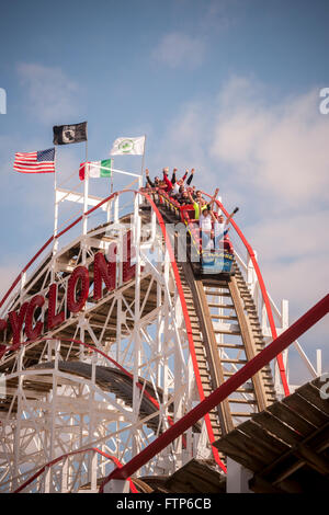 Coaster enthusiasts on opening day of the Cyclone roller coaster in Coney Island in New York on Saturday, March 26, 2016. The opening of the world-famous iconic wooden roller coaster heralds the arrival of the summer season.  (© Richard B. Levine) Stock Photo