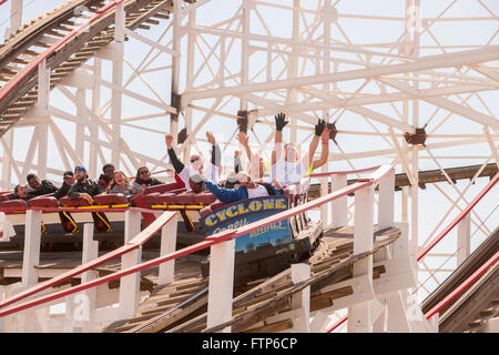 Coaster enthusiasts on opening day of the Cyclone roller coaster in Coney Island in New York on Saturday, March 26, 2016. The opening of the world-famous iconic wooden roller coaster heralds the arrival of the summer season.  (© Richard B. Levine) Stock Photo