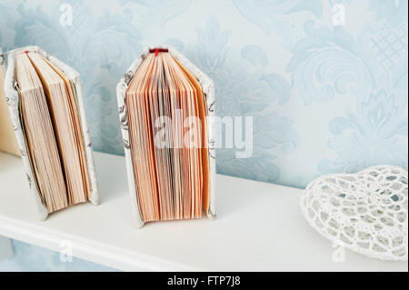 two books on the shelf decor in white studio Stock Photo