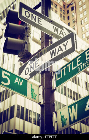 Vintage photo of the street signs for Fifth Avenue and Liitle Brazil street in Manhattan (New York City). Stock Photo