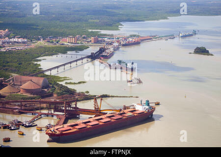 Aerial view of the silos piers and warehouses for grain and ship being loaded with iron ore Stock Photo