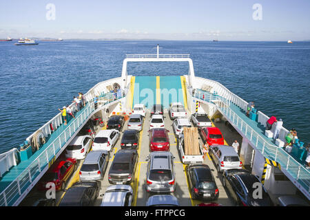 Car on board the ferry makes the crossing between the city and the Island of Itaparica Stock Photo