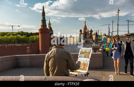 May 9, 2015. Moscow, Russia: Street artist painting Red Square in Moscow. Stock Photo