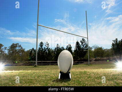 Rugby Ball in front of goal posts. Stock Photo