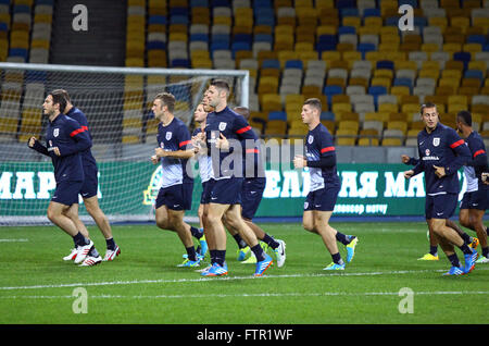 KYIV, UKRAINE - SEPTEMBER 9, 2013: England National football team players run during training session at NSC Olympic stadium before FIFA World Cup 2014 qualifier game against Ukraine Stock Photo