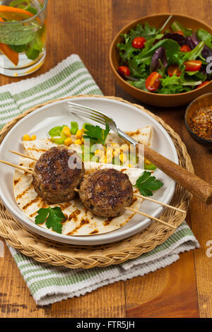 Homemade Cutlets or Sausage Patties Skewers for Dinner Stock Photo