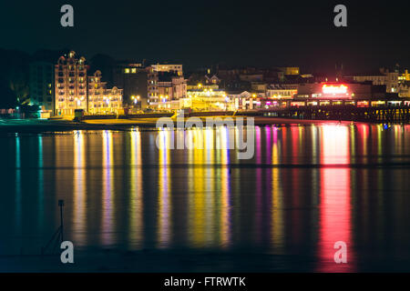 The view of Sandown Seafront and pier on the Isle of Wight, UK, as seen from Shanklin on a clear still night. Stock Photo