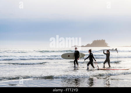 People with surfboards, Chesterman Beach, Tofino, British Columbia, Canada