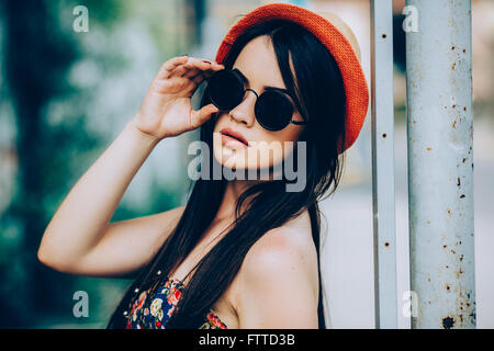 beautiful girl poses for camera in the city Stock Photo