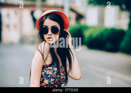 beautiful girl poses for camera in the city Stock Photo