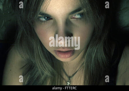 Young woman thriller closeup Stock Photo