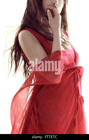 Brunette in red dress Stock Photo