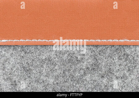 Background of close up on gray fabric texture and brown leather; Stock Photo