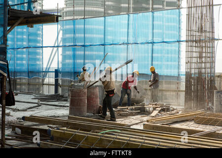 Construction workers on a high rise building in Kuala Lumpur, Malaysia Stock Photo