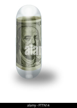 A gelatin capsule contains a rolled hundred dollar bill representing the high cost of health care. Stock Photo
