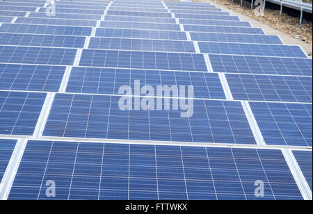 New installation of Solar panels on a roof, picture taken on the actual roof. March 2016 Stock Photo