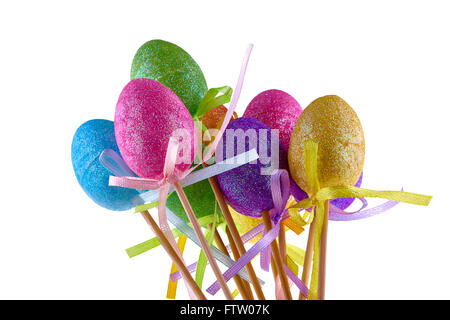 Colorful easter eggs on sticks isolated white Stock Photo