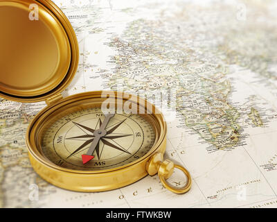 Vintage compass standing on old world map Stock Photo