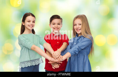 happy children with hands on top Stock Photo