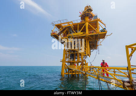 Man working in offshore oil rig environment Stock Photo