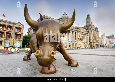 SHANGHAI, CHINA - JUNE 19, 2014: The Bund Bull sculpture in the morning. The work was unveiled in 2010. Stock Photo