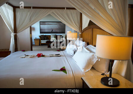 Bedroom and bed of the Luxury villa, suit room, in The Residence Hotel in Zanzibar island a semi-autonomous part of Tanzania, in Stock Photo