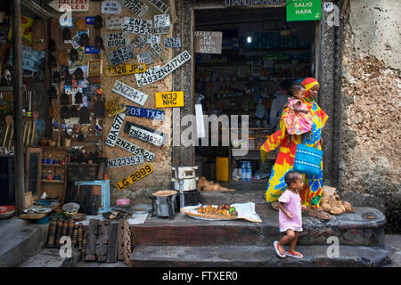 A general store in one of Stone Town s maze of narrow streets, Zanzibar, Tanzania. Car number plates for sale. Stock Photo