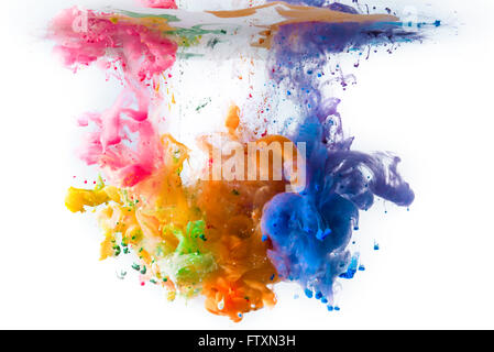 Multi-colored acrylic paints dissolving in water Stock Photo