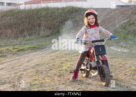 Girl riding motorbike, Granada, Andalucia, Spain Stock Photo
