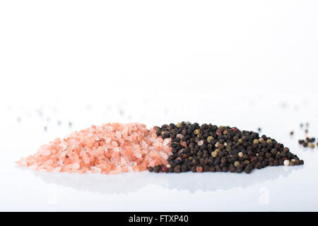 Himalayan rock salt and peppercorns. Stock Photo