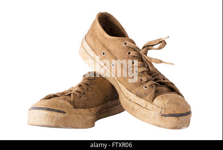 White sneakers dirty and muddy. On a white background Stock Photo