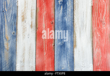 Stressed wooden boards painted red, white and blue for patriotic concept of United States of America. Layout in vertical format. Stock Photo