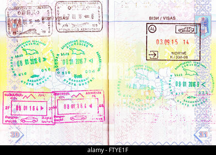 Passport with stamps of Azerbaijan, Georgia, Armenia, Albania Stock Photo