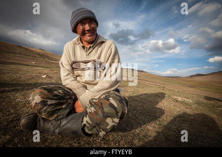 Kyrgyzstan, Kirghizistan, Asia, a smiling old man, shepherd in the steppe. Stock Photo