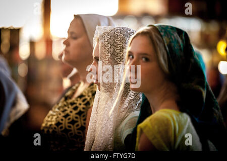 Kazakhstan, Kazakistan, Asia, veiled women in orthodox church for procession. Stock Photo