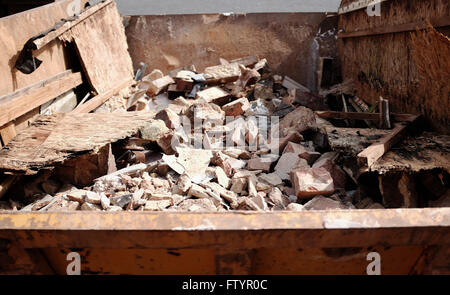 Builders Skip full of rubble DIY Stock Photo