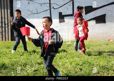 In the Florenc area of Prague on 28 March 2016, Chinese children go running and playing, displaying patriotic Chinese flags. Stock Photo