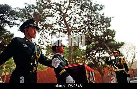 Shenyang, China. 31st March, 2016. Soldiers of the Chinese People's Liberation Army escort a coffin containing remains of a soldier of the Chinese People's Volunteers (CPV) killed in the Korean War, at a martyr cemetery in Shenyang, northeast China's Liaoning Province, March 31, 2016. The remains of 36 Chinese soldiers killed in the 1950-53 Korean War were returned to China on Thursday from the Republic of Korea (ROK), the third batch returned following a handover agreement signed by the two countries in 2013. Credit:  Xinhua/Alamy Live News Stock Photo