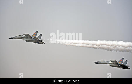 Shenyang. 31st Mar, 2016. Two Chinese J-11 fighter jets escort a transportation plane carrying coffins containing remains of soldiers of the Chinese People's Volunteers (CPV) killed in the Korean War, on March 31, 2016. The remains of 36 Chinese soldiers killed in the 1950-53 Korean War were returned to China on Thursday from the Republic of Korea (ROK), the third batch returned following a handover agreement signed by the two countries in 2013. Remains of a total number of 505 soldiers were returned to China in 2014 and 2015. Credit:  Yang Qing/Xinhua/Alamy Live News Stock Photo