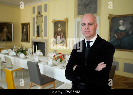 Berlin, Germany. 31st Mar, 2016. Curator Joerg Kirschstein poses in the exhibition 'Palaces for the State Visitor. State visits in the divided Germany' in Schoenhausen Palace in Berlin, Germany, 31 March 2016. From 01 April until 03 July 2016, The Prussian Palaces and Gardens Foundation Berlin-Brandenburg is showing the exhibition in Schoenhausen Palace. The Schoenhausen Palace was the guest house of the German Democratic Republic between 1966 and 1990. Photo: JOERG CARSTENSEN/dpa/Alamy Live News Stock Photo