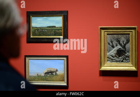 Berlin, Germany. 31st Mar, 2016. A man looks at paintings during a preview of the exhibition 'The Copenhagen School of Painting' in the Alte Nationalgalerie museum in Berlin, Germany, 31 March 2016. The pictures and studies from the Nationalgalerlie and the Christoph Mueller Collection can be seen from 01 April until 31 July 2016. Photo: JENS KALAENE/dpa/Alamy Live News Stock Photo