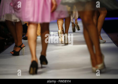 Kathmandu, Nepal. 31st Mar, 2016. Nepalese models (face unseen) catwalk on the runway on the second day of Nepal fashion week also known as The Himalayan Times TGIF Nepal Fashion Week at Hyatt Regency in Kathmandu, Nepal on Thursday, March 31, 2016. Celebrities and fashion models from around the world come to represent for the designers to promote their designs. The event is the top most fashion week of the country held annually by The Himalayan Times, a leading and largest selling English daily newspaper in Nepal. The fashion week lasts for 4 days with glitz and glamor on the catwalk. (Cred Stock Photo