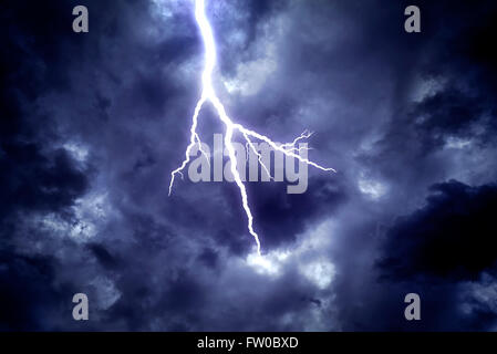 Lightning strike on the dark cloudy sky Stock Photo - Alamy