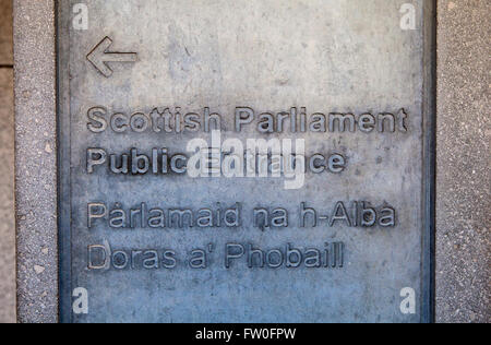 Direction sign for the entrance to the Scottish Parliament Building in Edinburgh, Scotland. Stock Photo